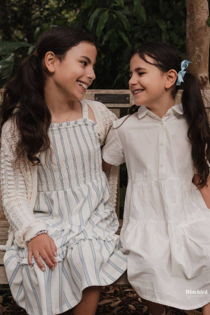 Siblings enjoying a photo shoot in Killara Park with Bluebird Photo Studio